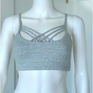 Lorna Jane sports bra size X Small in light gray cross cross in front
